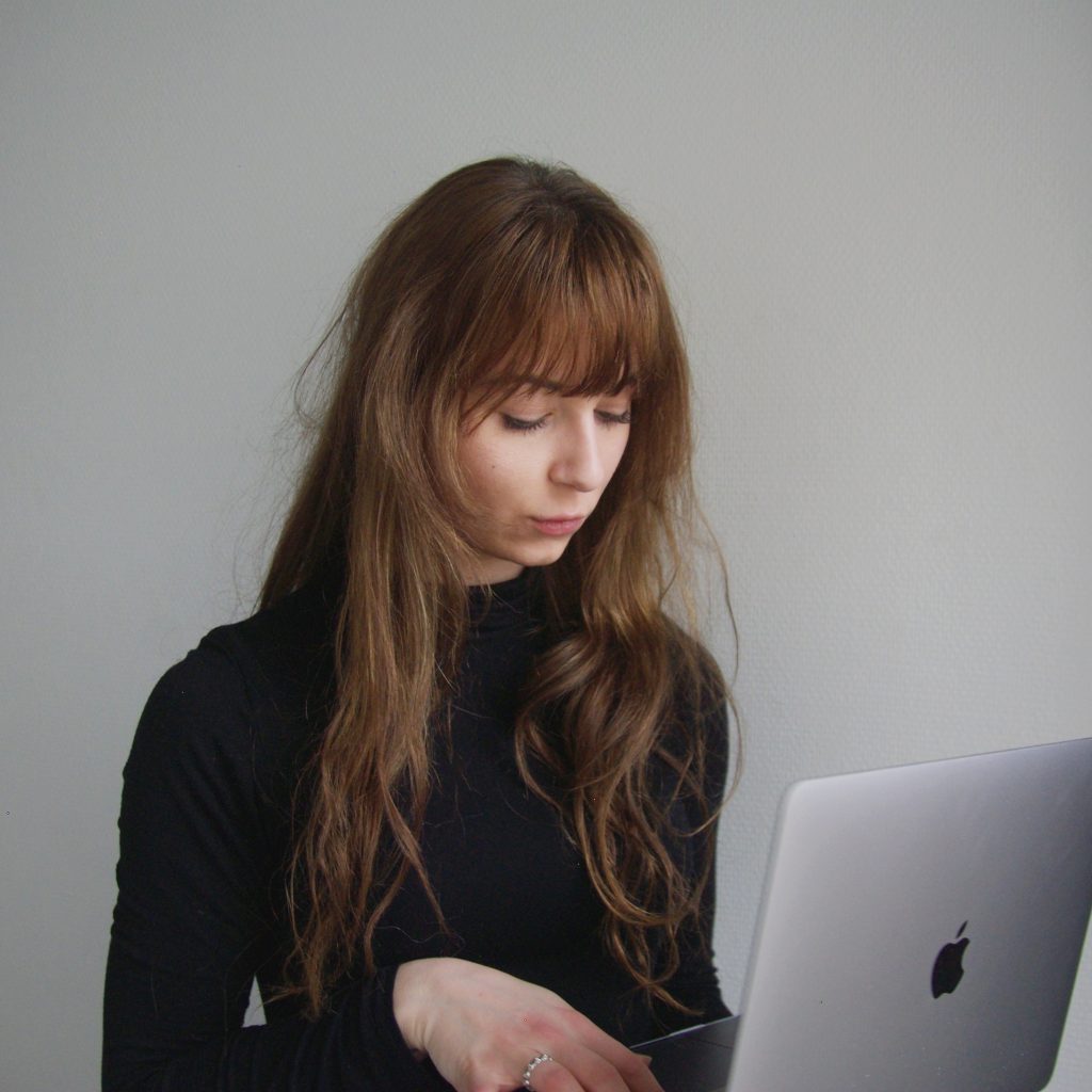 Photo of a lady surfing her LinkedIn Account with her Macbook