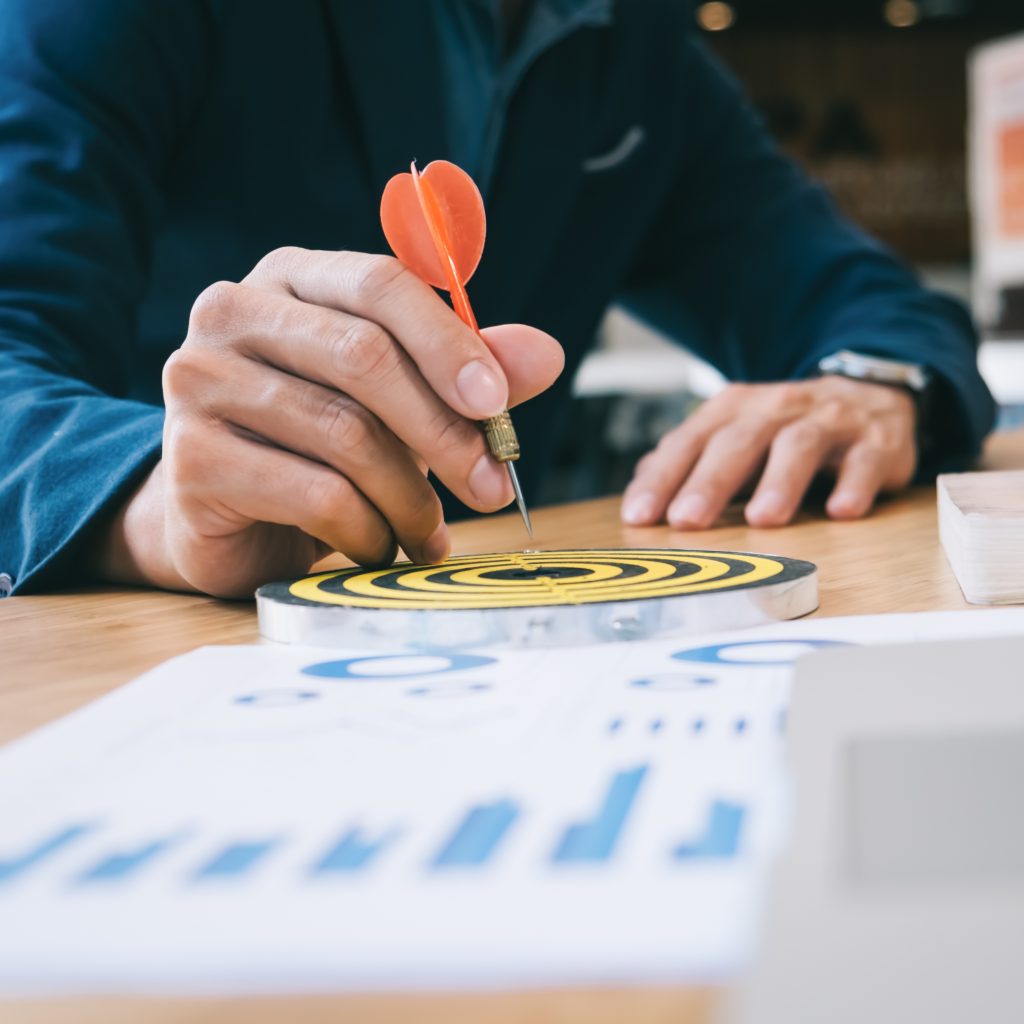 Businessman Holding a Darts Aiming at the Target